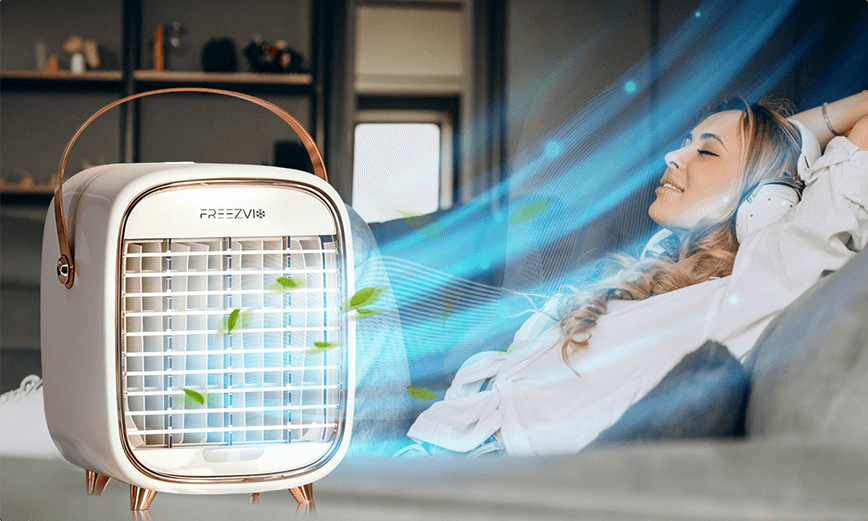 Woman relaxing beside a Freezvix blowing cool air